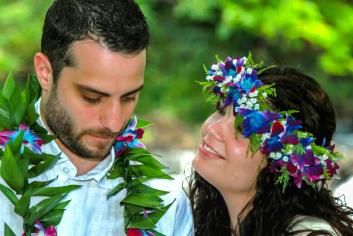 Couple in lei and haku head wreath