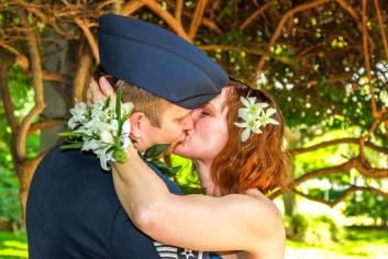 Kiss with floral bracelet on bride